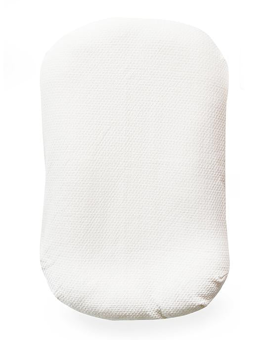 An image of Snuggle Me Organic Puddle Pad on a white surface.