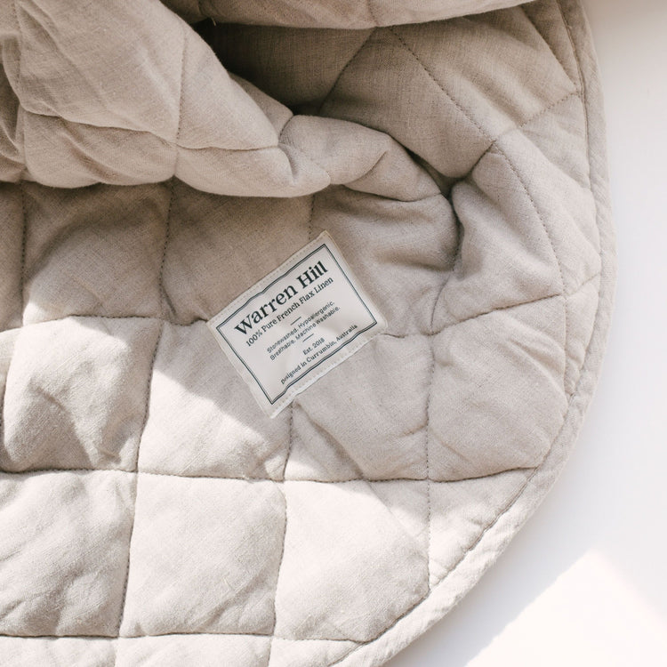 Our Warren Hill baby play mat is made from 100% Pure French Flax Linen with a soft, polyester filling that provides cushion and support for your child's delicate skin. Our linen is stonewashed giving it that beautiful soft, worn-in feel from the first time your child plays on it. Linen is naturally hypoallergenic, extremely durable, and one of the most sustainable materials to harvest and produce in the textile industry.